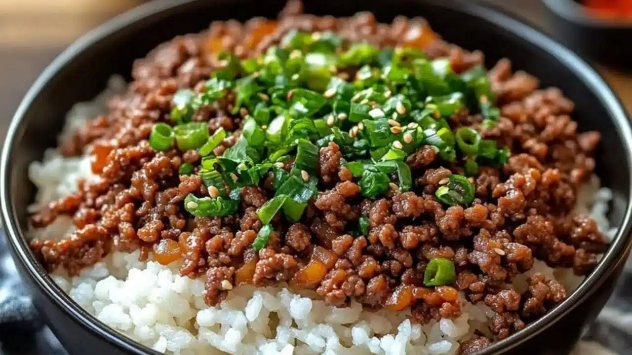 korean ground beef bowl with rice and green onions