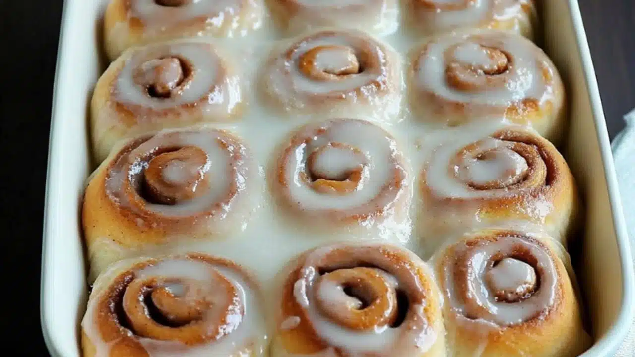 cinnamon rolls on a plate with the title
