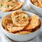 a white plate topped with cheesy potato chips