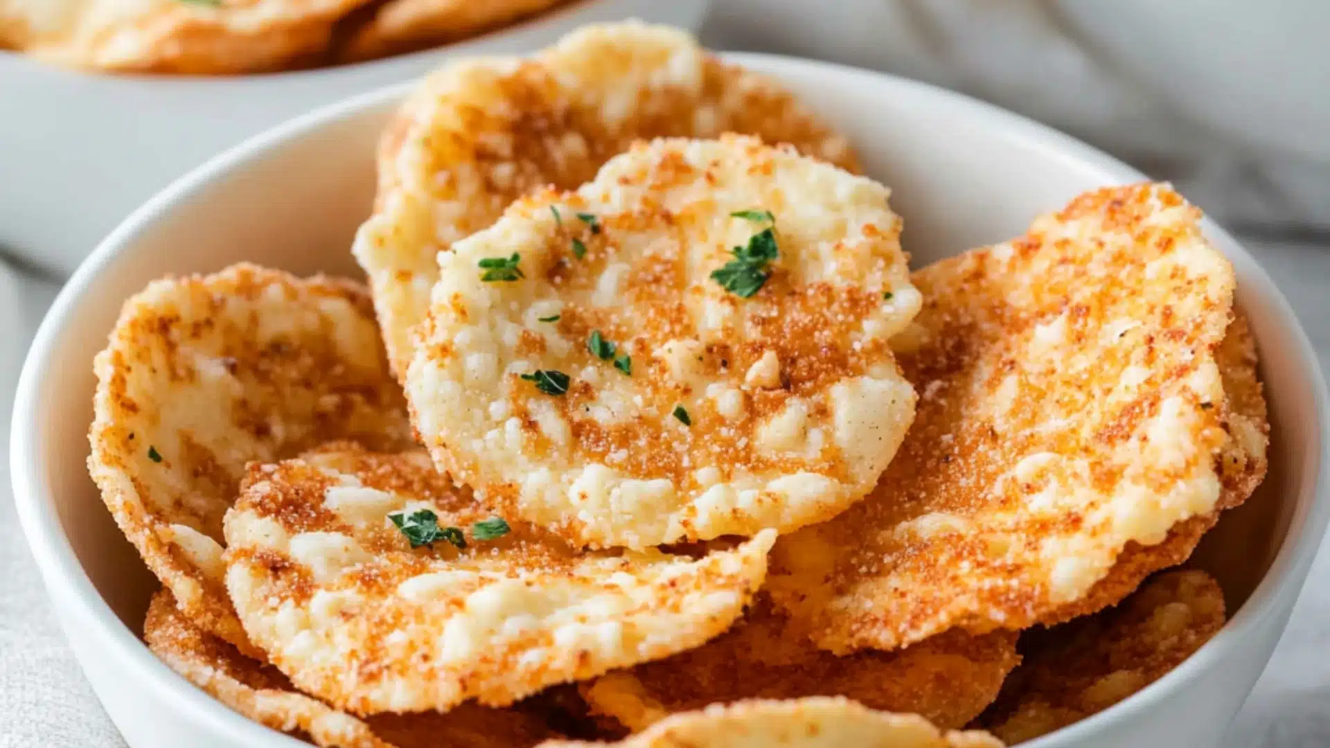 a white plate topped with cheesy potato chips