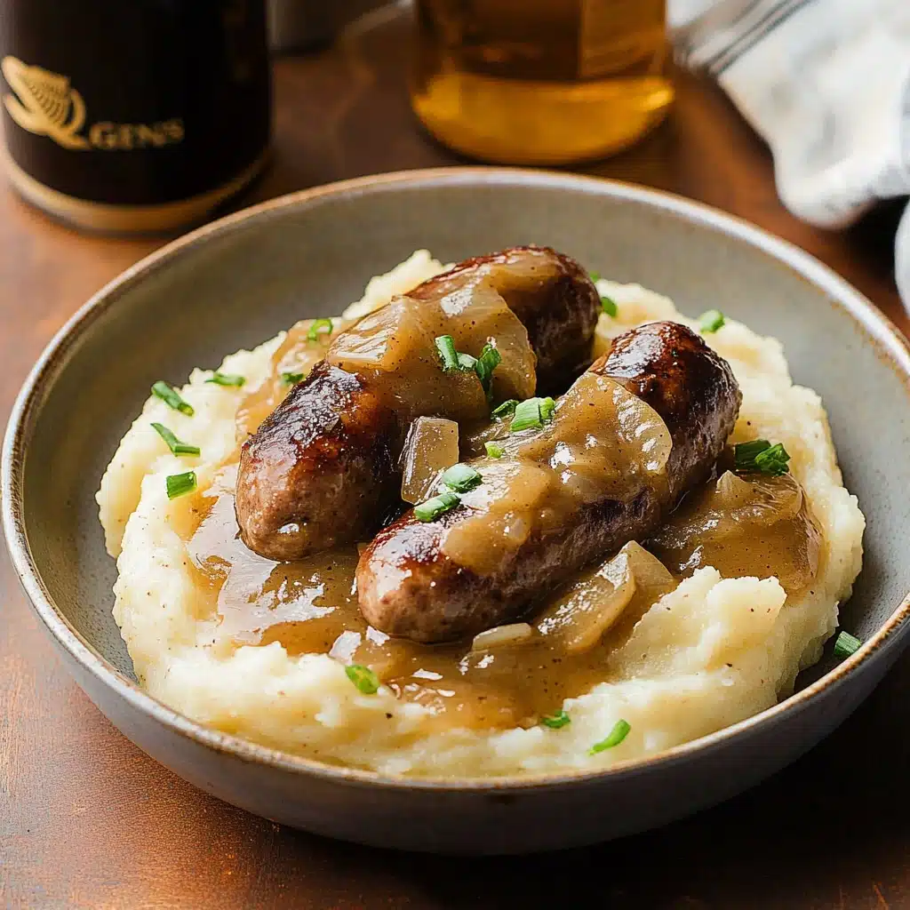 sausages and mash with guinness gravy in a skillet