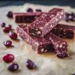 homemade nakd bar recipe with nuts and raisins on the side, including dates