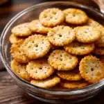 garlic ritz snacks in white bowls on a table