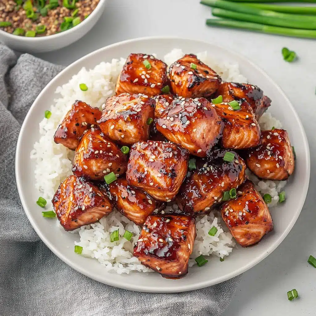 crispy honey garlic salmon bites with white rice and chopsticks