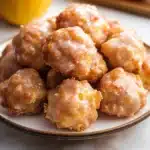 apple fritter bites on a plate with caramel sauce