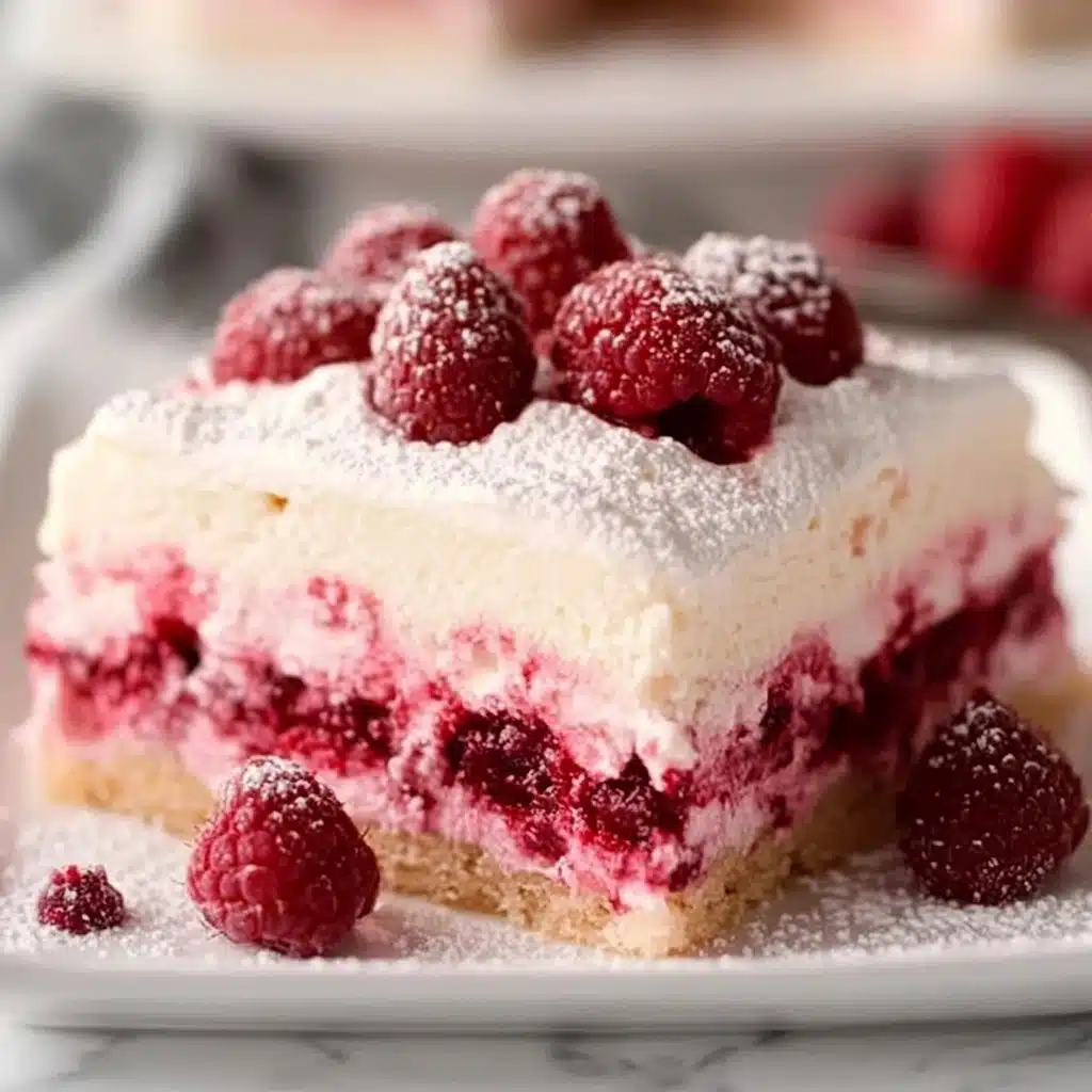 a white chocolate raspberry dessert on a plate