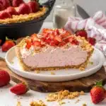 strawberry shortcake freezer pie on a white plate with pink sprinkles
