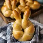 an easter bunny buns recipe on a wooden board