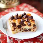chocolate croissant breakfast bake in a casserole dish with text overlay