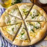 the white pizza is cut into eight slices