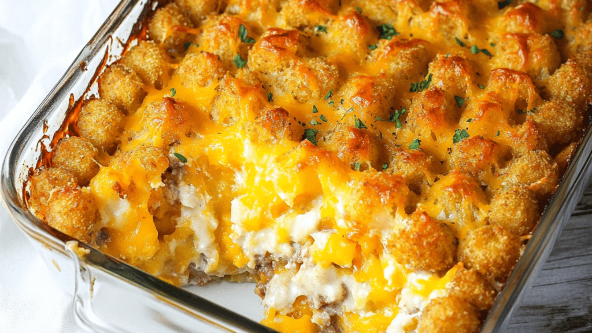 the secret spoon shepherd's pie meets tater tot casserole on a white plate