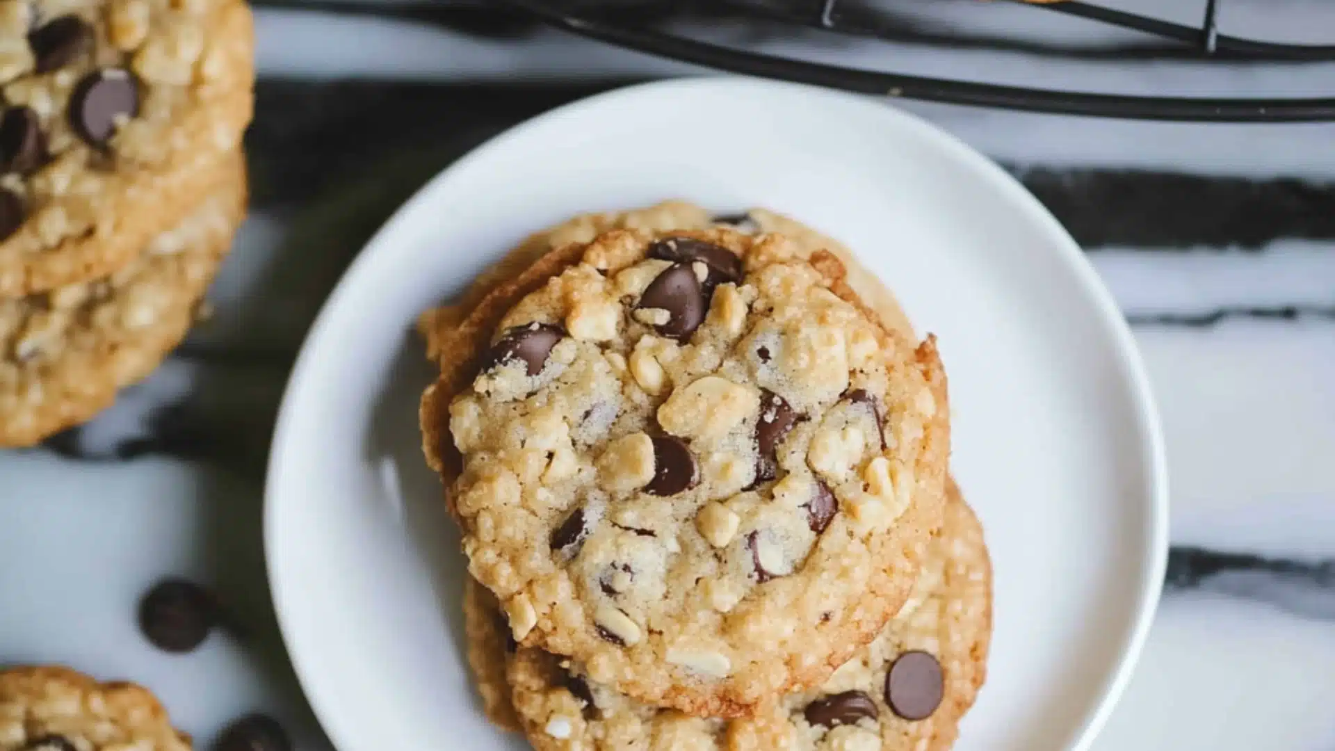 rice krispie chocolate chip cookies are cooling on the rack with text overlay that reads rice krispie chocolate chip cookies