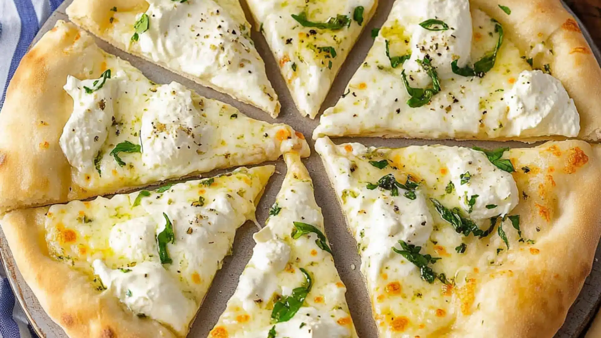 the white pizza is cut into eight slices