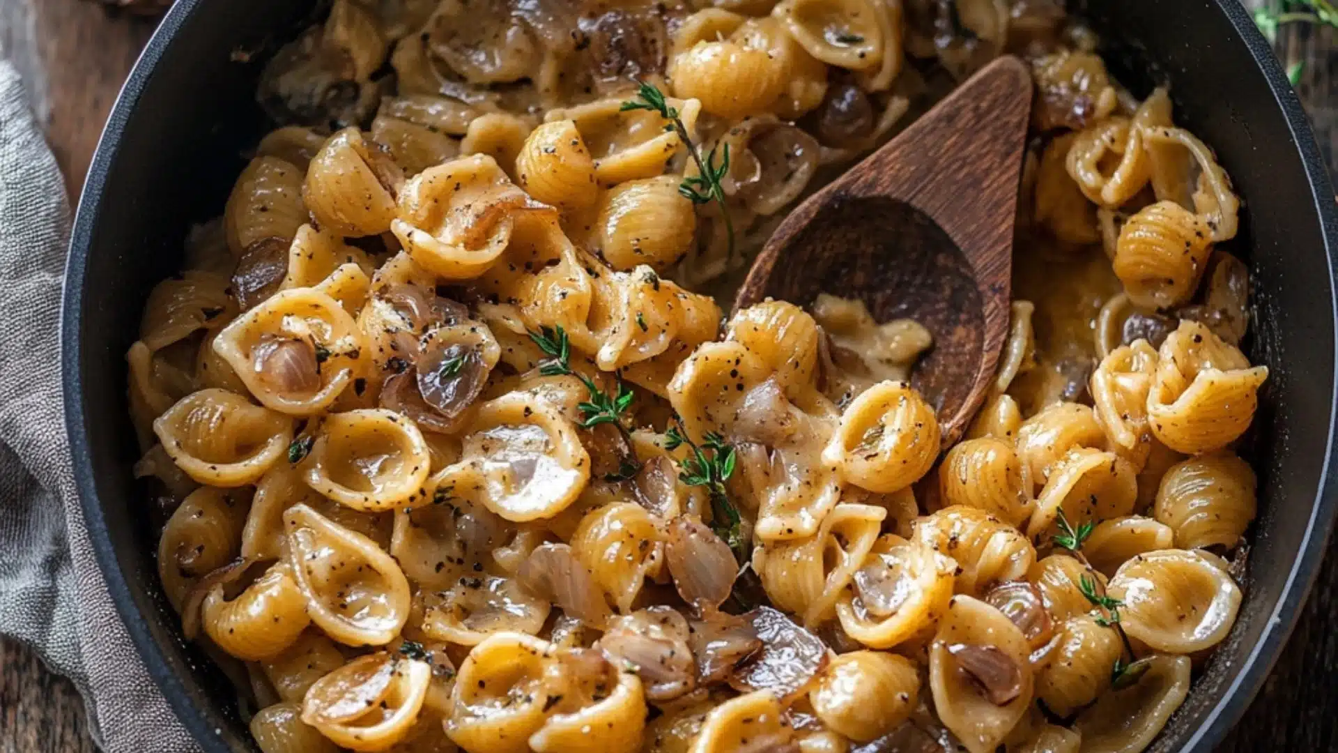 a white bowl filled with pasta covered in sauce