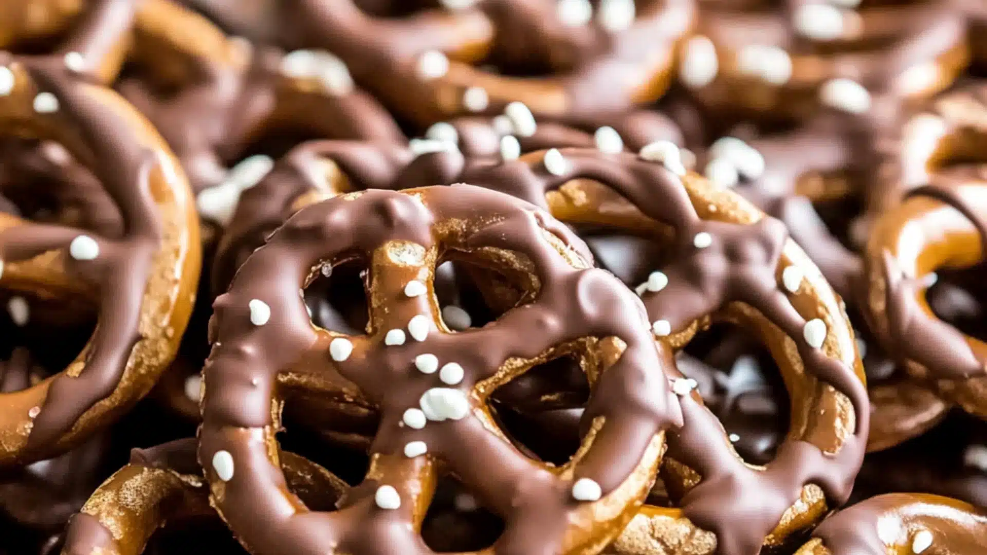 easter pretzels in the shape of cats and rabbits on a yellow plate with text overlay