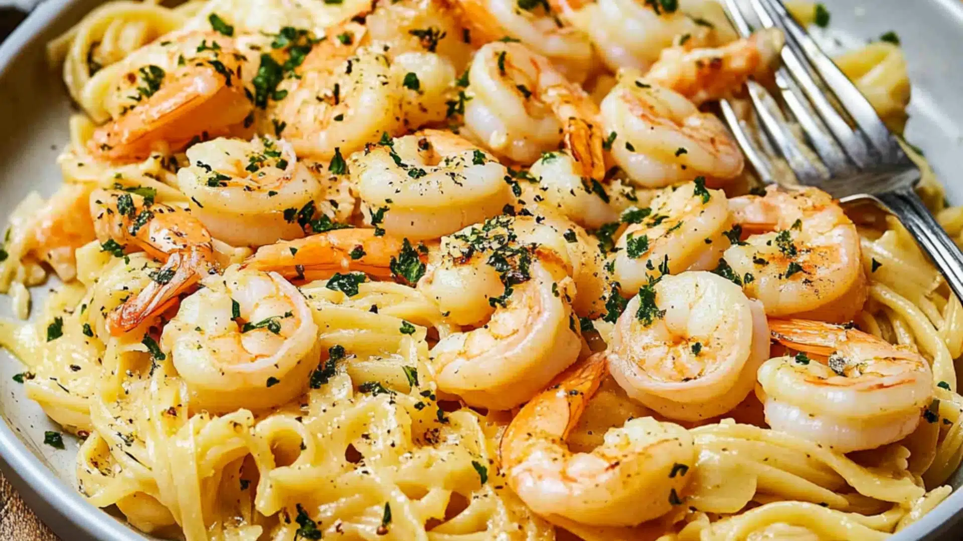 shrimp scampi pasta bake in a casserole dish with text overlay