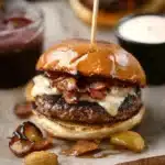 there are two burgers with onions on them and the words, irish pub burgers