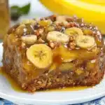 banana upside down cake with ice cream on top and bananas in the background text reads, banana upside down cake