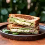 the grilled cheese sandwich is loaded with creamy avocado and cheesy