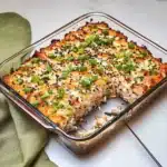 salmon sushi bake in a white casserole dish