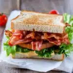 bacon sandwich with cheese and lettuce on it is shown in two different images