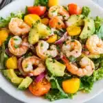 shrimp salad with avocado and cilantro in a white bowl