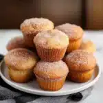 several donuts stacked on top of each other with cheesecake toppings in between them