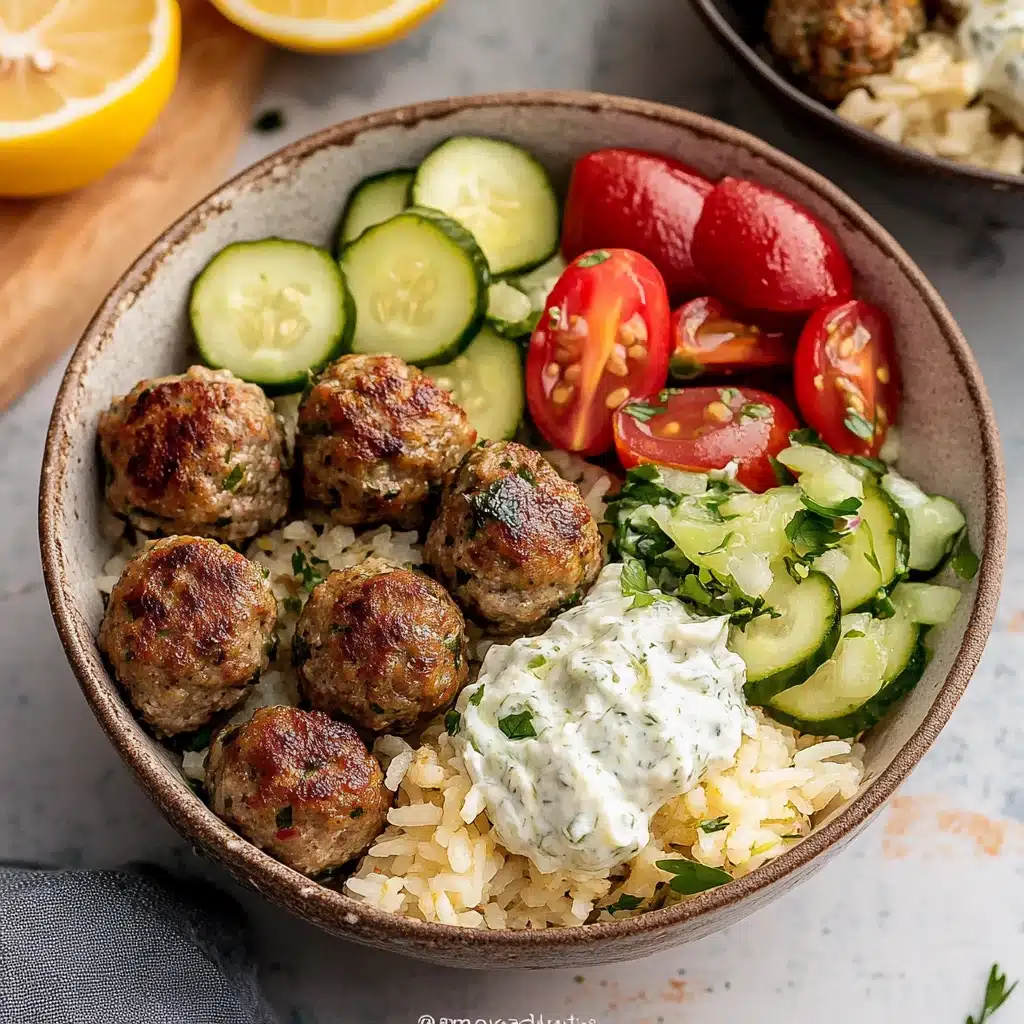 a plate with meatballs, rice and cucumber salad on it next to a fork