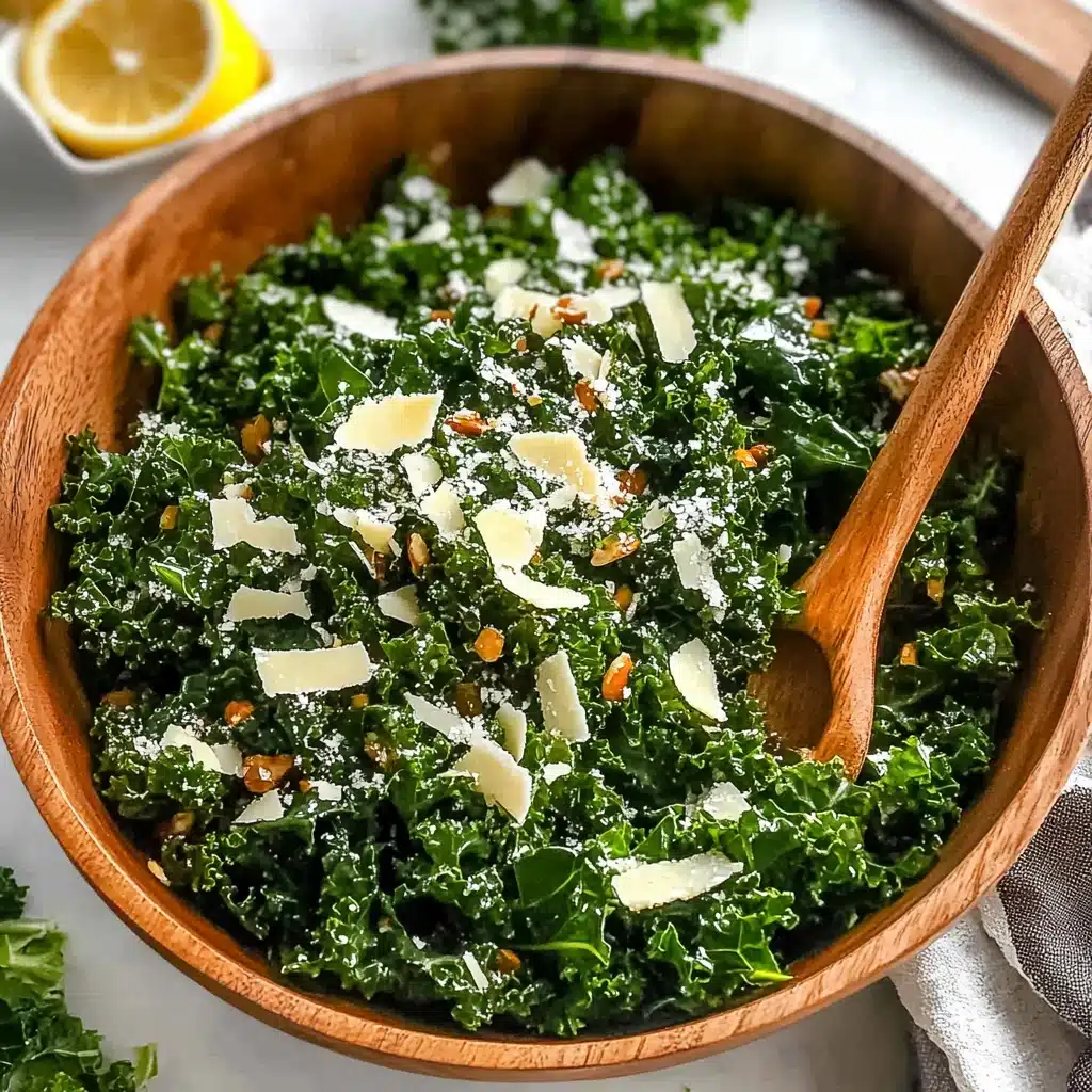lemon parm kale salad on a white plate with spoons next to it
