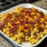 a casserole dish with meat and cheese in it