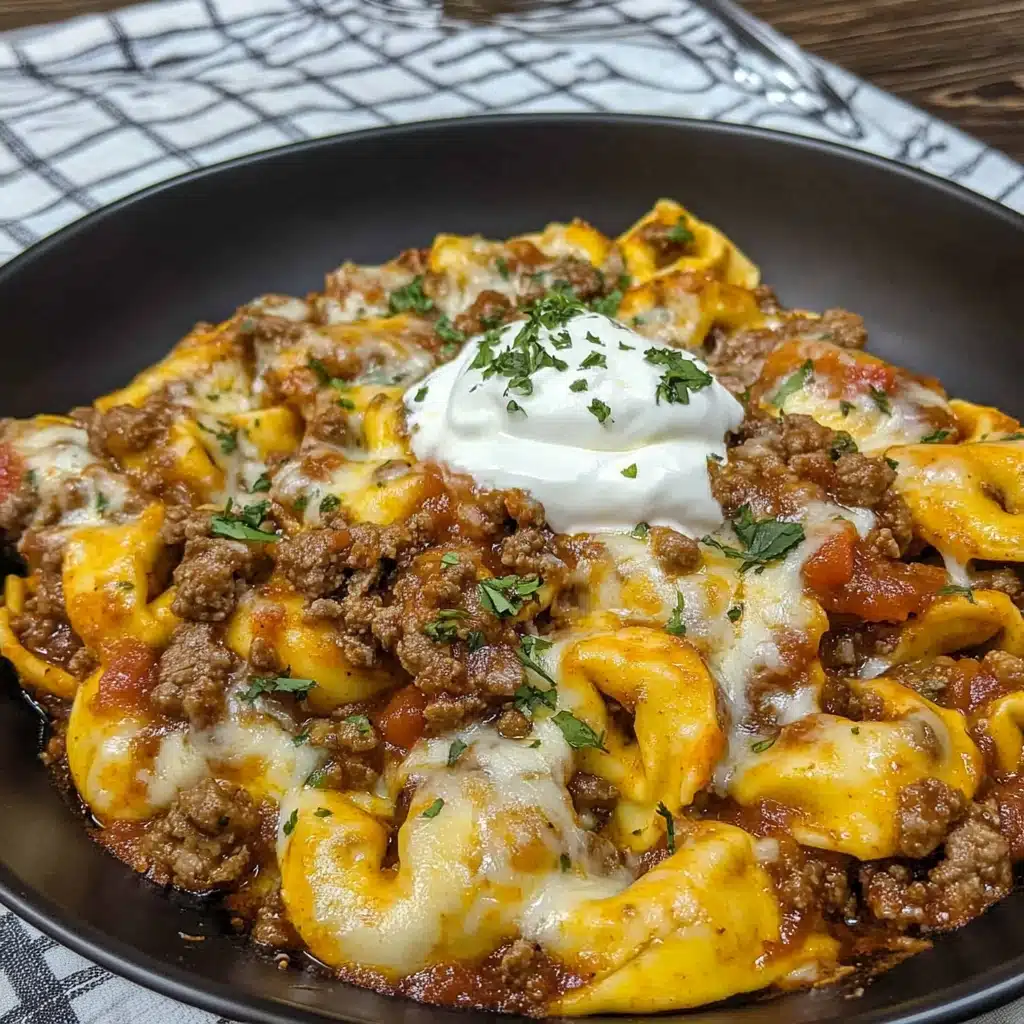 cheesy beef enchilada tortellini in a white bowl