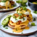 two appetizers are sitting on a plate with sauce and green garnish