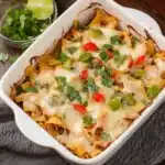 two casserole dishes with cheese and vegetables in them
