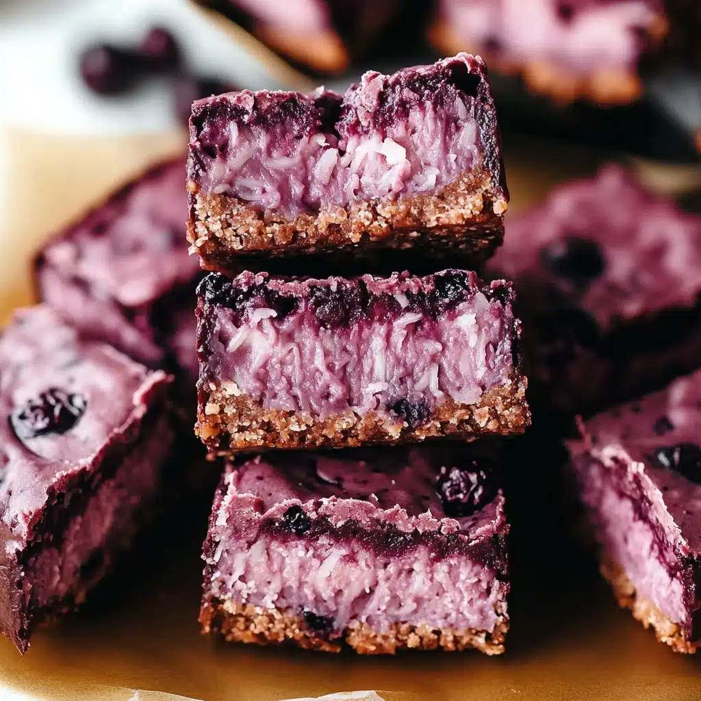 chocolate and raspberry coconut bars stacked on top of each other with text overlay