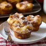 french toast muffins on a white plate with powdered sugar and the words quick & delicious