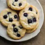chewy lemon blueberry cookies stacked on top of each other with text overlay