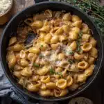 a white bowl filled with pasta covered in sauce