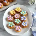 colorful candies are arranged on a plate with the words spring flower pretzel bites