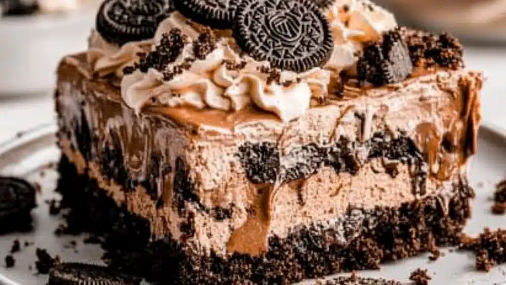 a close up of a cake on a plate with the words oreo dirt cake