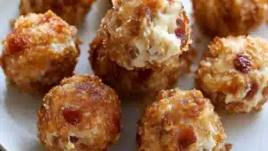 a white plate topped with mini cheese balls